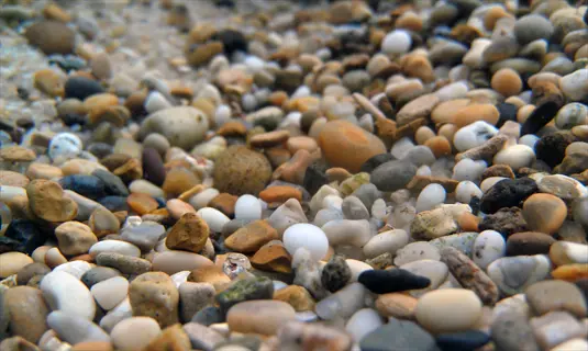 assorted aquarium gravel substrate with mixed natural pebbles and stones for freshwater tank environments