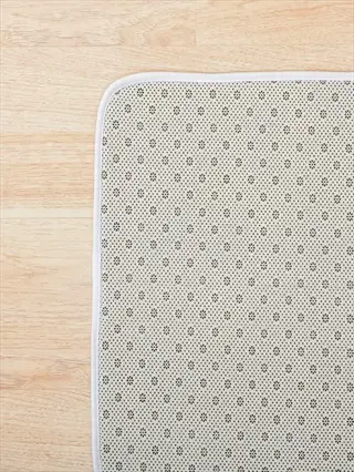 bathtub non slip mat with textured anti-slip backing on wooden floor - bathroom safety product for wet surfaces