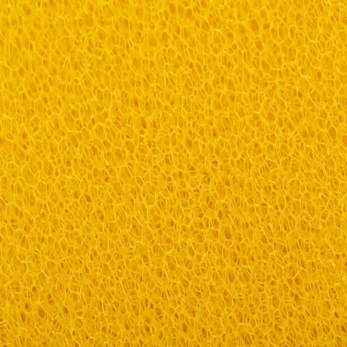 close-up of yellow porous aquarium filter sponge used for mechanical filtration and cleaning during maintenance