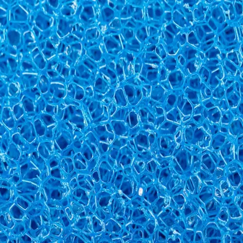 closeup view of blue porous aquarium filter material showing intricate sponge-like structure